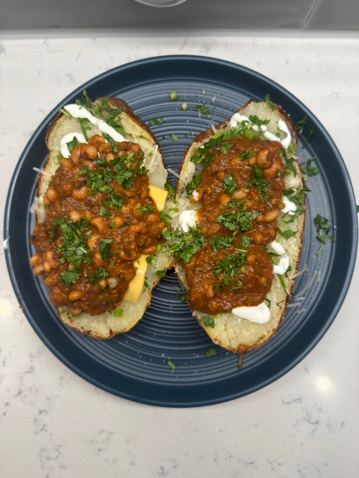 Loaded baked potato with black-eyed pea chili